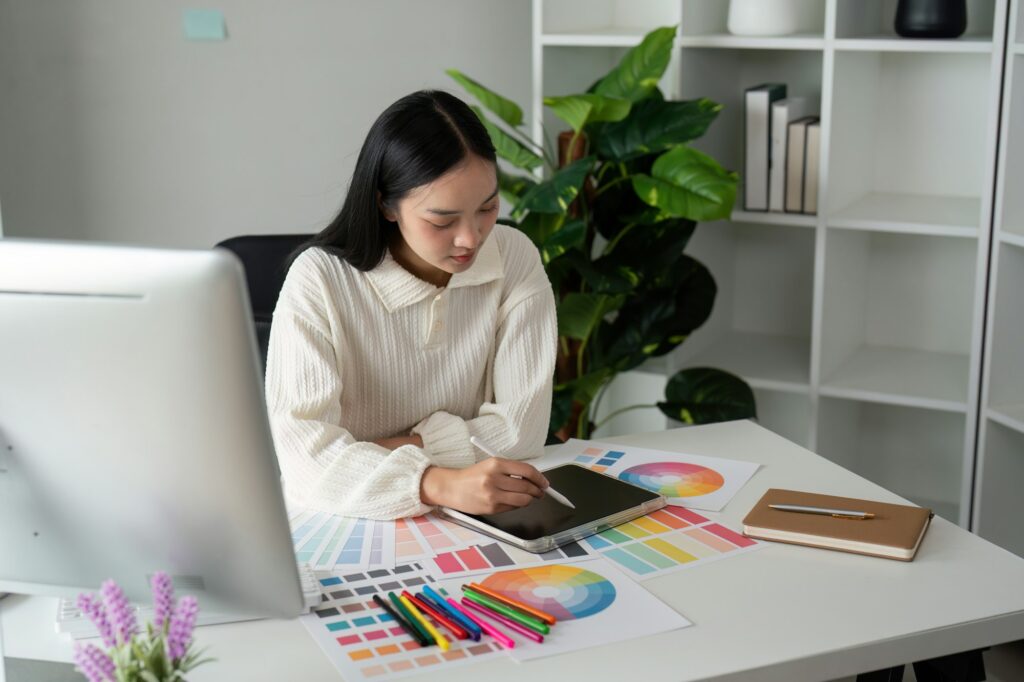 Asian woman graphic designer working in home office. Artist creative designer illustrator graphic